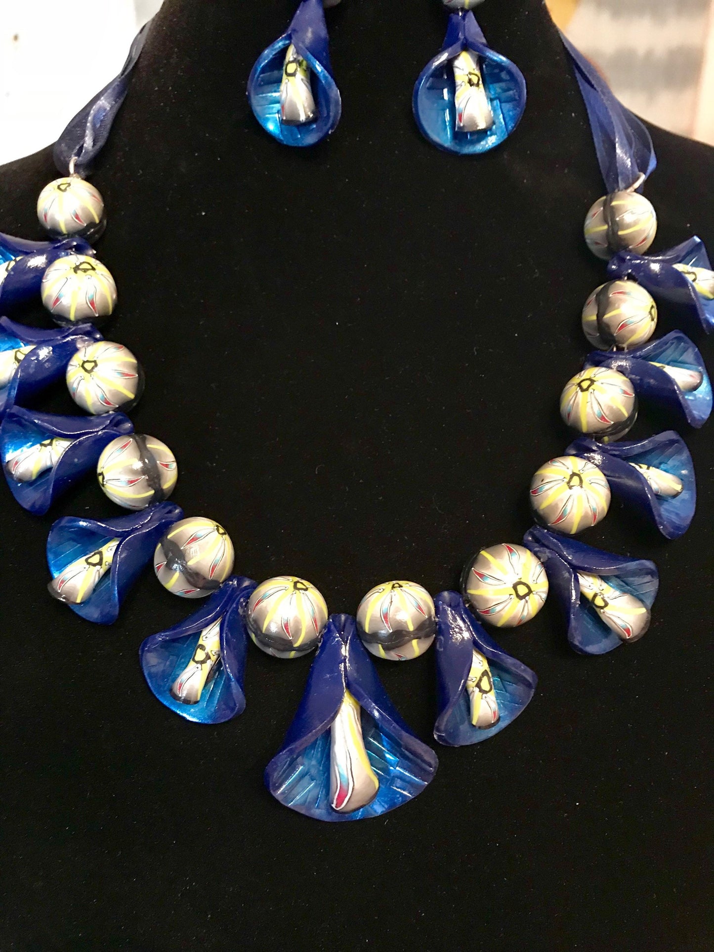 Dark Blue Peddle Necklace and Earring Set with Light Green Accents